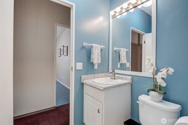 bathroom with vanity and toilet