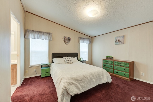 bedroom with lofted ceiling, ornamental molding, dark colored carpet, and a textured ceiling