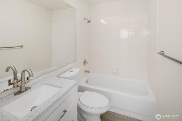 full bathroom with shower / bathtub combination, vanity, and toilet