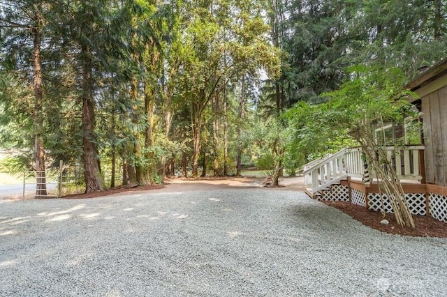 view of yard with a wooden deck