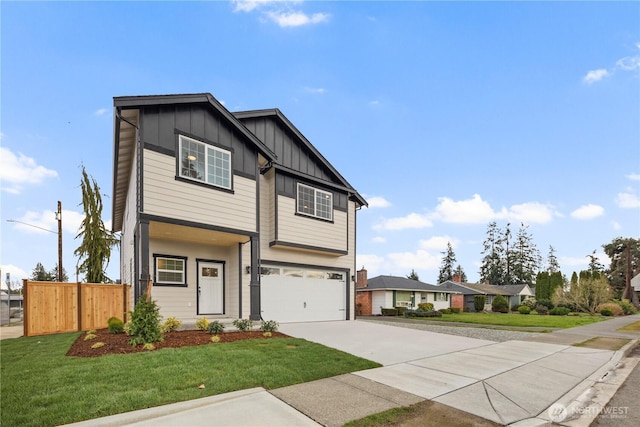 view of front of home featuring a front yard, fence, concrete driveway, a garage, and board and batten siding