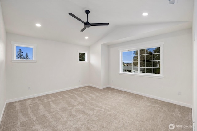 spare room featuring lofted ceiling, recessed lighting, carpet floors, baseboards, and ceiling fan