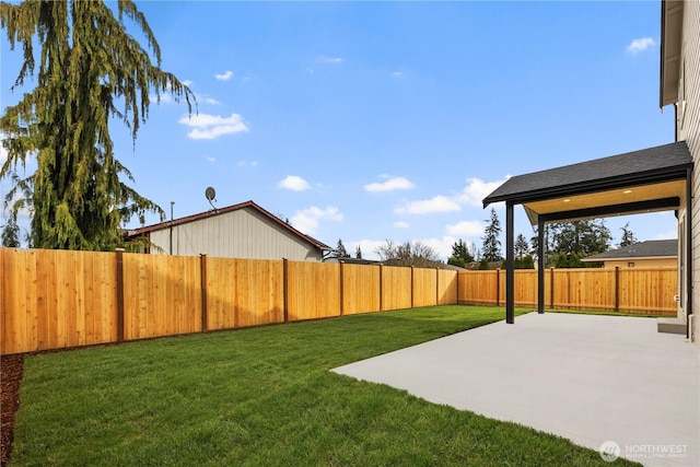 view of yard featuring a patio area and a fenced backyard