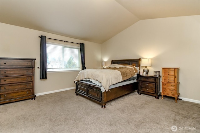 carpeted bedroom featuring vaulted ceiling and baseboards