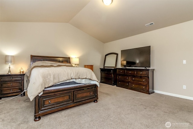 carpeted bedroom featuring lofted ceiling, visible vents, and baseboards