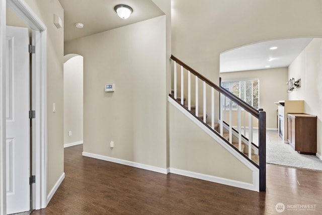 14426 99th Ave SE, Yelm, WA 98597 - stairway with arched walkways, wood finished floors, and baseboards