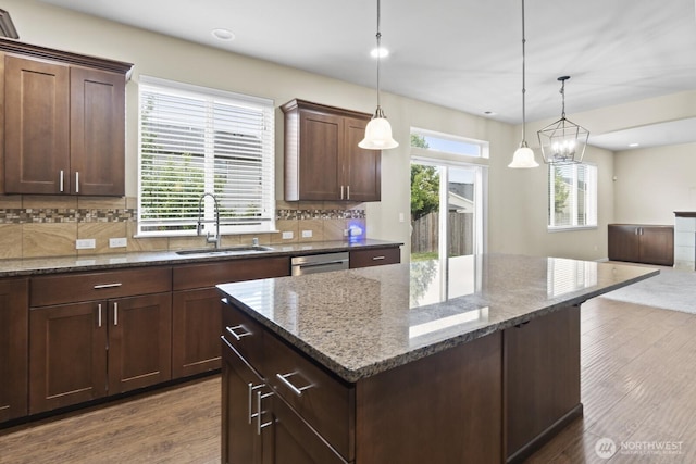 14426 99th Ave SE, Yelm, WA 98597 - kitchen with a sink, dark wood-type flooring, backsplash, a center island, and recessed lighting