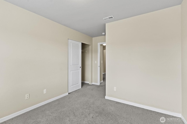 14426 99th Ave SE, Yelm, WA 98597 - unfurnished bedroom with carpet flooring, baseboards, and a closet