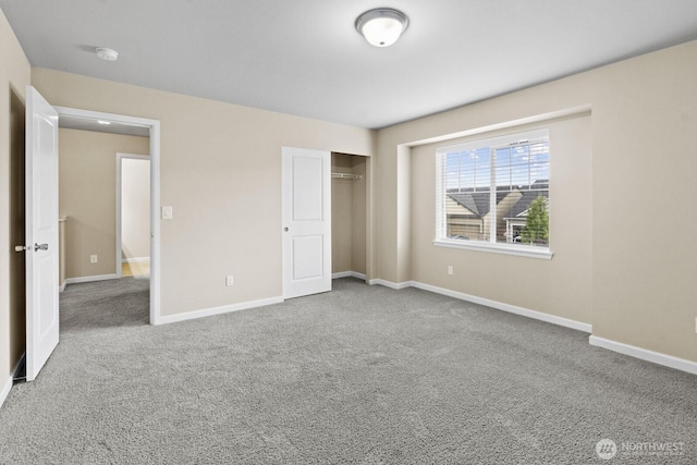 14426 99th Ave SE, Yelm, WA 98597 - unfurnished bedroom featuring carpet, a closet, and baseboards