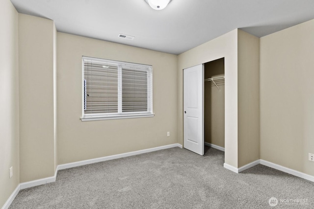 14426 99th Ave SE, Yelm, WA 98597 - unfurnished bedroom featuring carpet floors, baseboards, and a closet