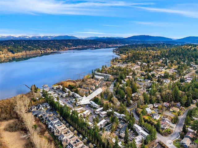 aerial view featuring a water and mountain view