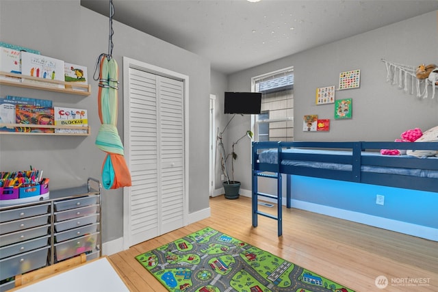 bedroom featuring a closet and hardwood / wood-style flooring