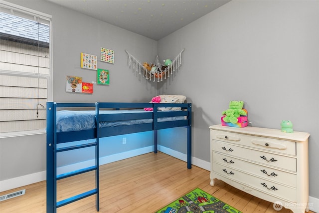 bedroom with light wood-type flooring