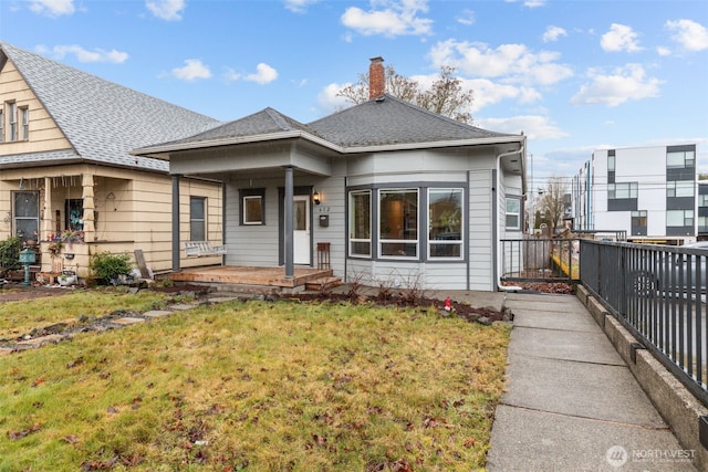 bungalow-style house featuring a front yard