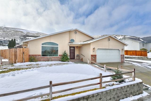 single story home featuring a garage