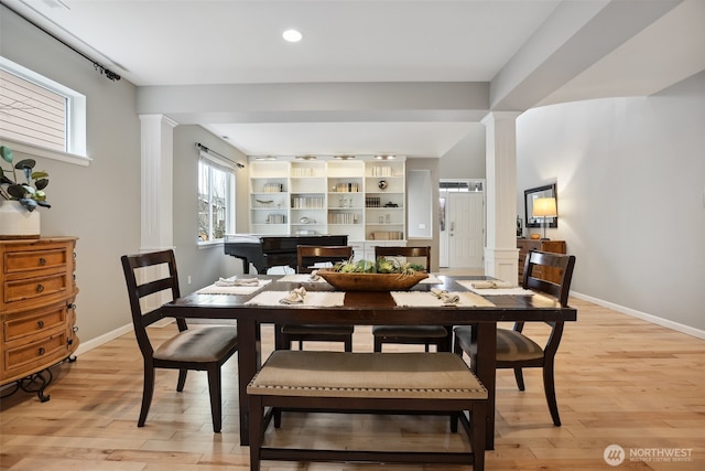 dining space featuring recessed lighting, decorative columns, light wood-style flooring, and baseboards