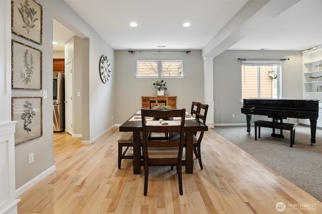 dining space with recessed lighting, light wood-type flooring, and baseboards