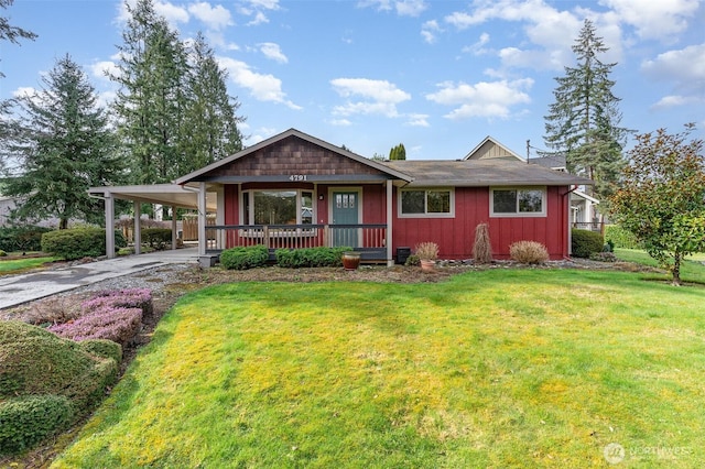 view of front of house with a porch, board and batten siding, concrete driveway, a front yard, and a carport