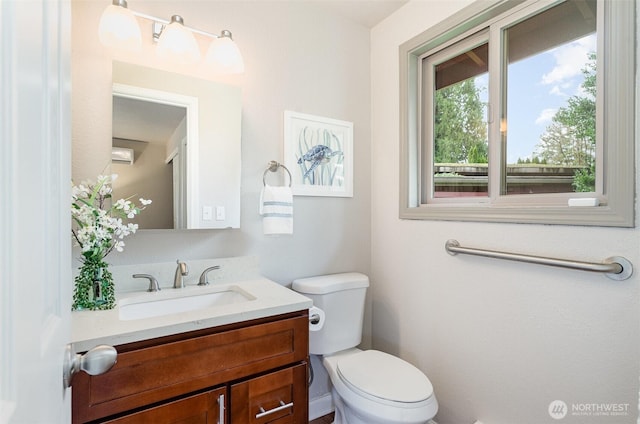 half bathroom featuring toilet and vanity