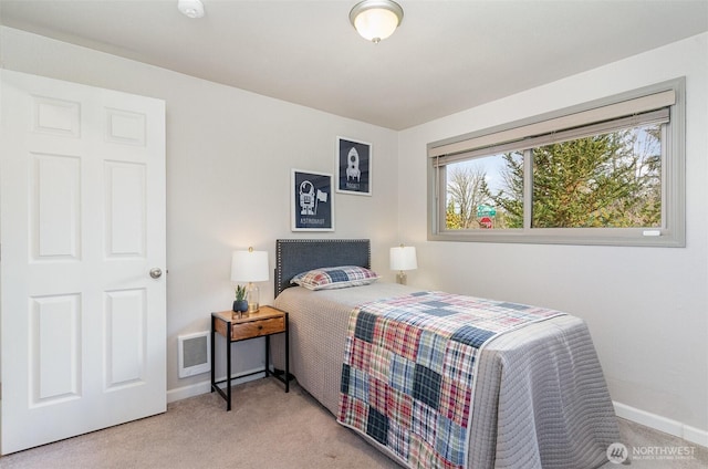 bedroom featuring visible vents, baseboards, and carpet