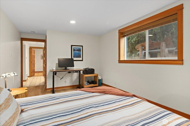 bedroom featuring baseboards and recessed lighting