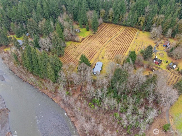 birds eye view of property with a rural view