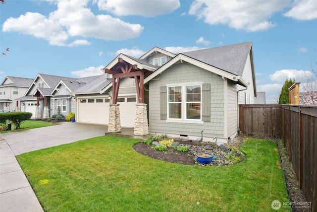 view of front of house with concrete driveway, fence, an attached garage, crawl space, and a front lawn