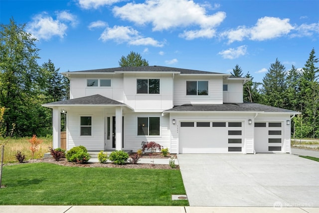 5846 229th Ave E, Buckley, WA 98321 - prairie-style house with driveway, a porch, a front lawn, and a garage