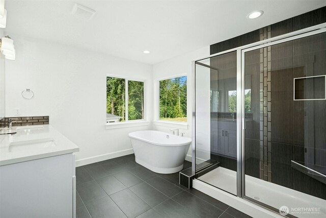 5846 229th Ave E, Buckley, WA 98321 - full bathroom featuring a stall shower, a soaking tub, tile patterned floors, double vanity, and recessed lighting