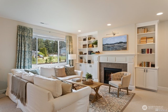 carpeted living room with a fireplace and built in shelves