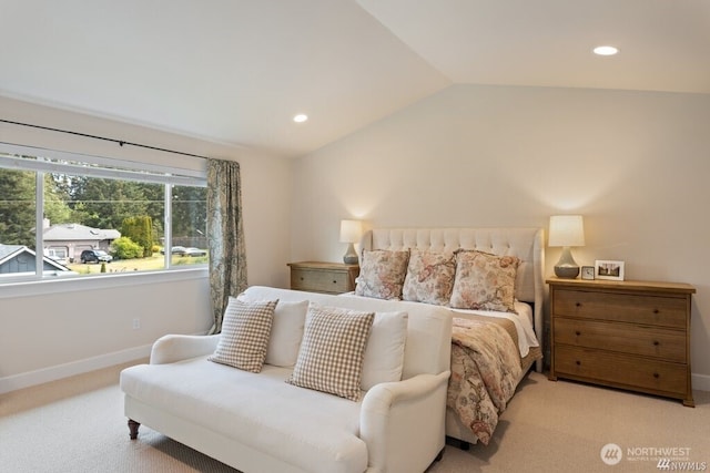 carpeted bedroom with lofted ceiling