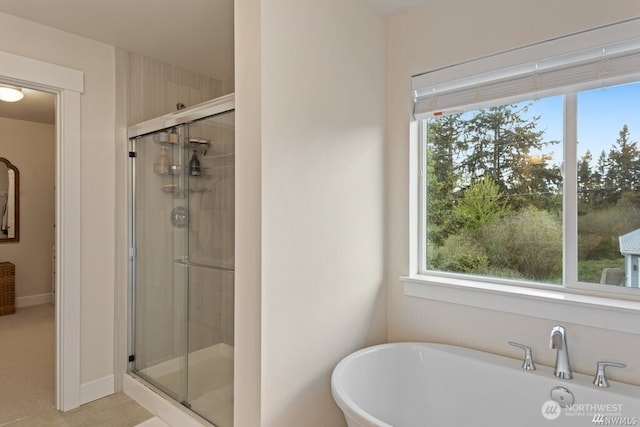 bathroom with plus walk in shower and plenty of natural light