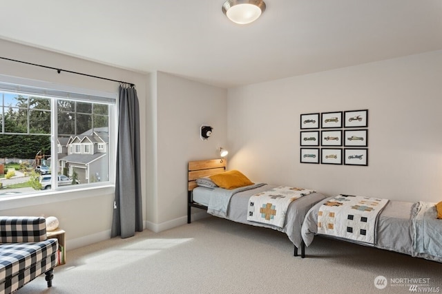 bedroom featuring light colored carpet