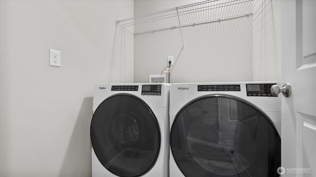 clothes washing area with laundry area and washer and dryer