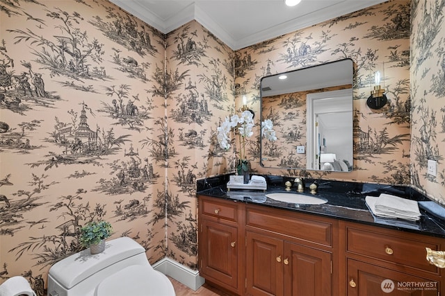 bathroom featuring ornamental molding, toilet, and vanity