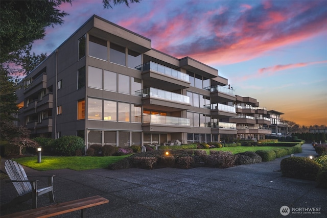 view of outdoor building at dusk