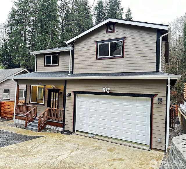 front of property featuring a garage and covered porch