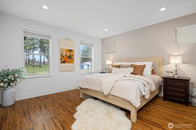 bedroom featuring recessed lighting, dark wood-style flooring, visible vents, and baseboards