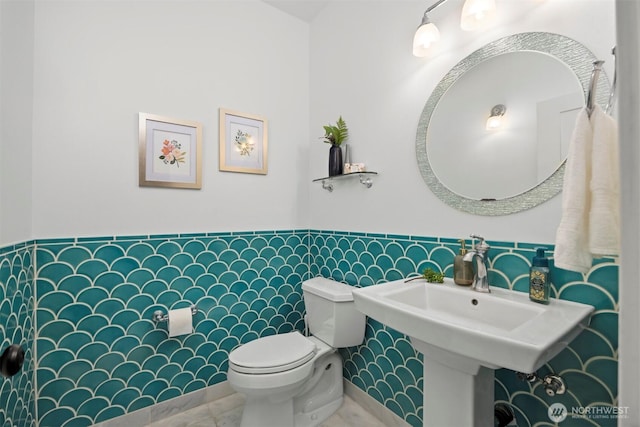 half bath with a sink and toilet