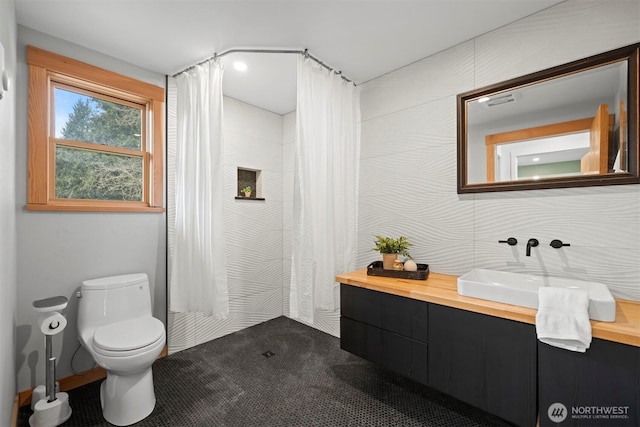 full bath with toilet, visible vents, and vanity