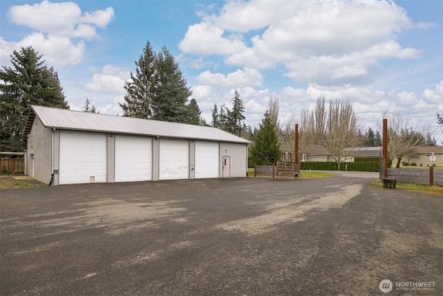 garage with fence