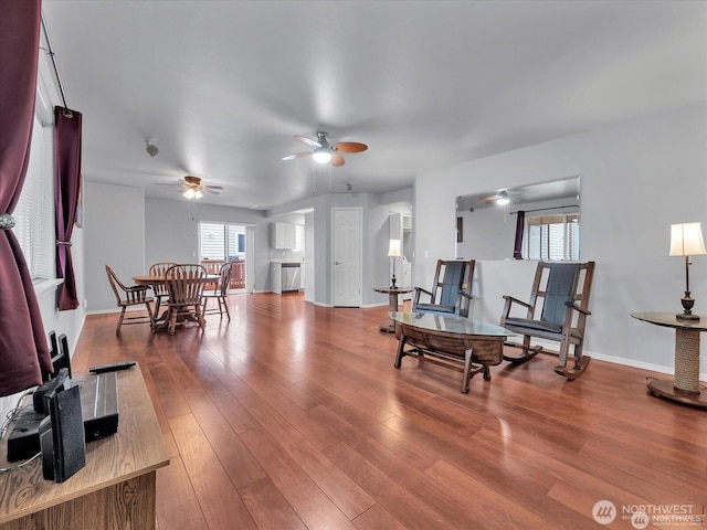 interior space featuring hardwood / wood-style flooring, ceiling fan, and a wealth of natural light