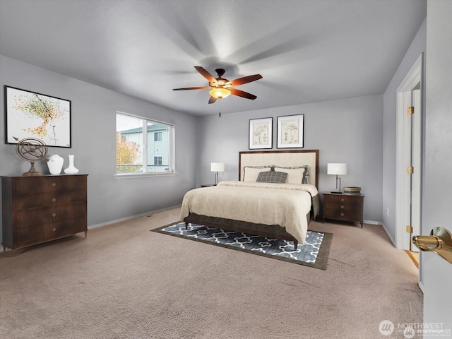 bedroom featuring light colored carpet and ceiling fan