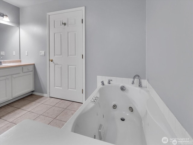 bathroom with vanity, a bathtub, and tile patterned floors