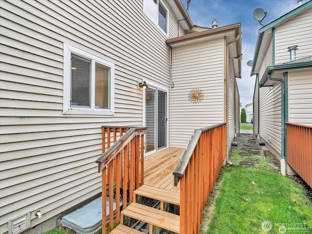 wooden terrace featuring a yard