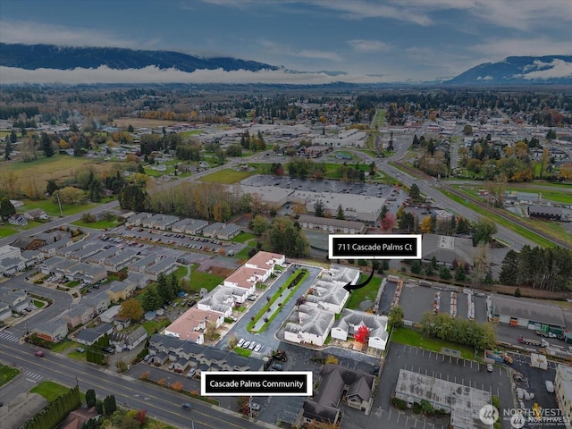 birds eye view of property featuring a mountain view