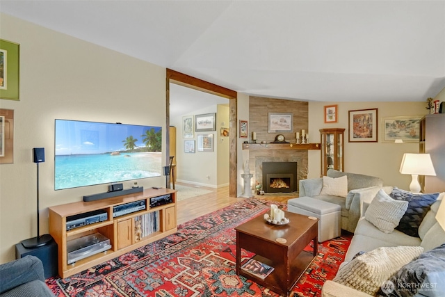 living room featuring hardwood / wood-style flooring and vaulted ceiling