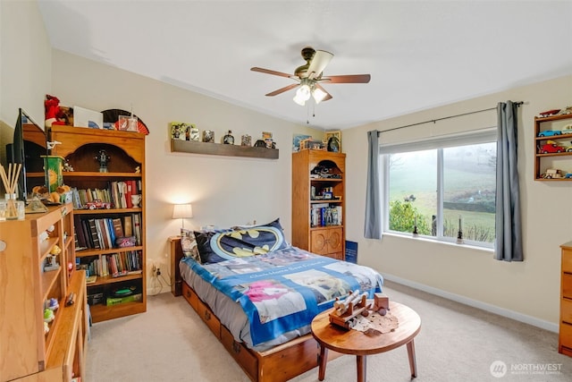 bedroom with ceiling fan and light colored carpet