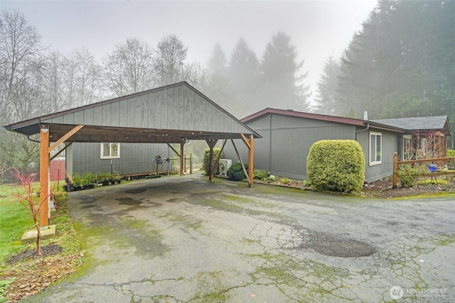 view of side of home featuring a carport