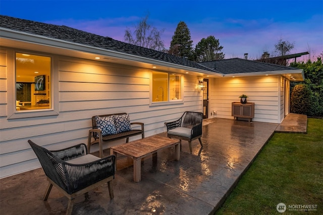 patio terrace at dusk featuring outdoor lounge area